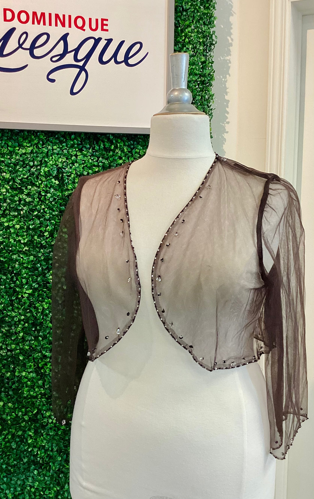 Sheer brown shrug on a mannequin with &