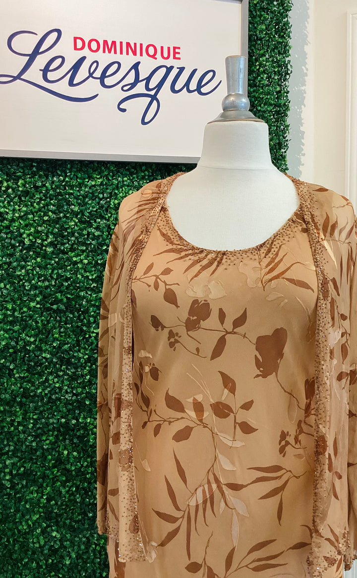Mannequin wearing a beige floral dress with &