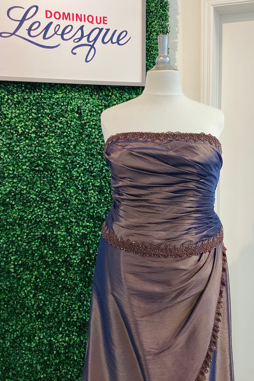 Cocoa strapless gown on a mannequin with &