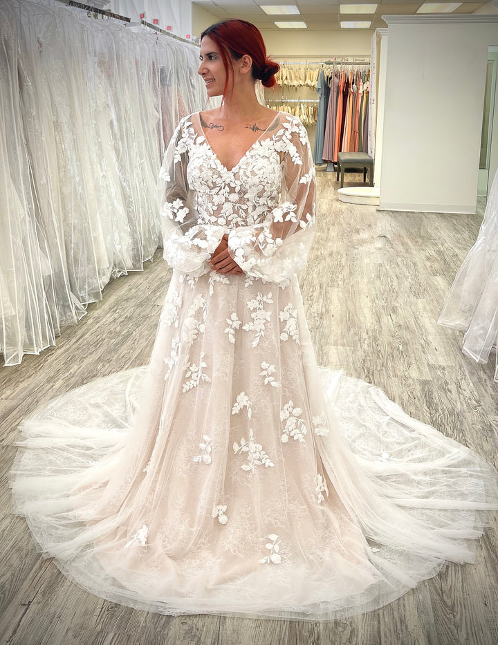Women wearing blush lace wedding dress